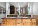 Bathroom featuring dual sinks, granite countertops, and contemporary lighting fixtures at 4446 Songbird Ln, Evergreen, CO 80439