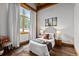 Comfortable bedroom with hardwood floors, natural light, and stylish decor at 4446 Songbird Ln, Evergreen, CO 80439