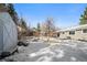 Snowy backyard with shed and partial home view at 287 Johnson Dr, Castle Rock, CO 80104