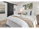 Bedroom with queen bed, barn door, and window at 287 Johnson Dr, Castle Rock, CO 80104