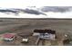 Expansive rural property features a spacious home, separate barn/shed buildings, long driveway and picturesque views at 4820 S County Road 137, Bennett, CO 80102
