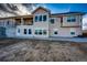 Spacious two-story home features an expansive back patio and a second-story balcony overlooking the yard at 4820 S County Road 137, Bennett, CO 80102