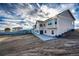 Expansive backyard with a spacious patio and a glimpse of an outbuilding, perfect for outdoor living at 4820 S County Road 137, Bennett, CO 80102