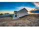 View of the house with its back patio and scenic rural setting at 4820 S County Road 137, Bennett, CO 80102