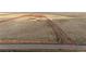 An expansive parcel of land ready for development with a long road, surrounded by a red fence at 4820 S County Road 137, Bennett, CO 80102