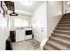 Bright laundry room with modern washer and dryer, plus convenient storage at 4820 S County Road 137, Bennett, CO 80102