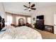 Serene main bedroom offers ample space, neutral tones, and large windows with elegant sheer curtains at 4820 S County Road 137, Bennett, CO 80102