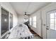 Recreation room featuring a bubble hockey table, treadmill, and lots of natural light at 4820 S County Road 137, Bennett, CO 80102
