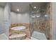 A luxurious bathroom featuring soaking tub and a tiled glass shower at 8100 E Union Ave # 1603, Denver, CO 80237
