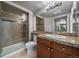 Bathroom featuring a glass enclosed tiled shower, vanity, and ample mirror space at 8100 E Union Ave # 1603, Denver, CO 80237