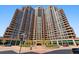 Stunning exterior of a tall luxury apartment building with beautifully landscaped entrance and prominent location at 8100 E Union Ave # 1603, Denver, CO 80237