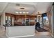 Modern kitchen featuring stainless steel appliances, granite countertops, and a central island with a breakfast bar at 8100 E Union Ave # 1603, Denver, CO 80237