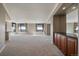 Open living space with city views framed by large windows and modern gray walls with cream colored trim at 8100 E Union Ave # 1603, Denver, CO 80237
