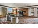 Comfortable resident lounge featuring plush seating, built-in entertainment, and elegant decor, ideal for relaxation at 8100 E Union Ave # 1603, Denver, CO 80237