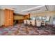 A shared meeting space with large table and chairs, cabinets and a sink, and whiteboards at 8100 E Union Ave # 1603, Denver, CO 80237