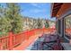 Outdoor deck with views, chairs and a table at 3439 Burnham Dr, Kittredge, CO 80457