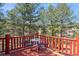 Outdoor deck with views, table and chairs at 3439 Burnham Dr, Kittredge, CO 80457