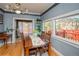 Inviting dining room with hardwood floors and access to an outdoor deck at 3439 Burnham Dr, Kittredge, CO 80457