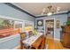 Charming dining room featuring a large window and decorative chandelier at 3439 Burnham Dr, Kittredge, CO 80457