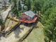 Desirable home featuring a large, inviting deck, ample parking and a fenced yard perfect for outdoor enjoyment at 3439 Burnham Dr, Kittredge, CO 80457