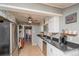 Charming kitchen with ample cabinet space, granite countertops, and stainless steel appliances at 3439 Burnham Dr, Kittredge, CO 80457