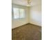 Well-lit bedroom with carpeted floors and window at 5103 Wheeling St, Denver, CO 80239