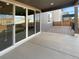 Covered back patio with concrete floor, support columns, and view of backyard at 228 N Edge Cliff St, Castle Rock, CO 80104