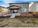 Backyard featuring a patio, deck, and a fenced yard, perfect for outdoor entertaining at 228 N Edge Cliff St, Castle Rock, CO 80104