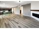 Open-concept living room and kitchen with wood floors and modern finishes at 228 N Edge Cliff St, Castle Rock, CO 80104