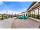 Outdoor patio area with modern lounge chairs and a cozy fire pit feature at 16251 E 47Th Pl, Denver, CO 80239