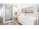Stylish bathroom with a walk-in glass shower and a modern vanity at 269 Delaware St, Denver, CO 80223
