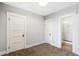 Bedroom featuring carpet, white trim, and ensuite bathroom at 269 Delaware St, Denver, CO 80223