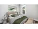 Inviting bedroom with soft natural light, neutral tones, and soothing green accents, promoting a relaxed ambiance at 269 Delaware St, Denver, CO 80223