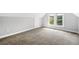 Spacious bedroom with plush carpeting, a bright window, and neutral paint at 269 Delaware St, Denver, CO 80223