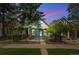 Charming blue home featuring a lovely front yard and a secure black fence at 269 Delaware St, Denver, CO 80223
