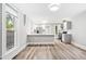 Bright, open kitchen with stainless steel appliances and an island bar at 269 Delaware St, Denver, CO 80223