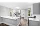 Contemporary kitchen featuring a kitchen island with sink, and updated stainless steel appliances at 269 Delaware St, Denver, CO 80223