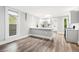Spacious, well-lit kitchen with modern appliances and an island with sink at 269 Delaware St, Denver, CO 80223