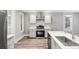 Updated kitchen features stainless steel appliances, ample cabinetry, and natural light at 269 Delaware St, Denver, CO 80223