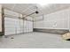 Spacious unfinished garage with concrete floor, ready for customization and storage at 6834 Merseyside Ln, Castle Pines, CO 80108