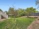 Large backyard with a manicured lawn, a storage shed and plenty of space for outdoor enjoyment at 12991 E Idaho Dr, Aurora, CO 80012