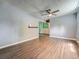 Finished basement showcasing hardwood floors, light gray walls, and open doorway at 12991 E Idaho Dr, Aurora, CO 80012