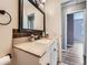 Bathroom with vanity, large mirror, and neutral walls at 12991 E Idaho Dr, Aurora, CO 80012