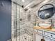 Modern bathroom featuring a unique vanity, glass shower and decorative tile at 12991 E Idaho Dr, Aurora, CO 80012
