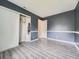 Bedroom with closet, gray-blue walls, white trim and neutral floors at 12991 E Idaho Dr, Aurora, CO 80012