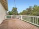 Expansive wooden deck featuring a white railing offering ample space for entertaining and relaxation at 12991 E Idaho Dr, Aurora, CO 80012