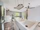 Kitchen with stainless steel appliances, large sink, and a view to the living room at 12991 E Idaho Dr, Aurora, CO 80012