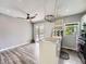 Kitchen with breakfast nook, island, and sliding doors to a deck at 12991 E Idaho Dr, Aurora, CO 80012