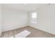 Well-lit bedroom featuring neutral carpet and a sunlit window at 17847 Dandy Brush Dr, Parker, CO 80134