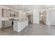 Modern kitchen with gray cabinets, stainless steel appliances, and a center island with countertop seating at 17847 Dandy Brush Dr, Parker, CO 80134